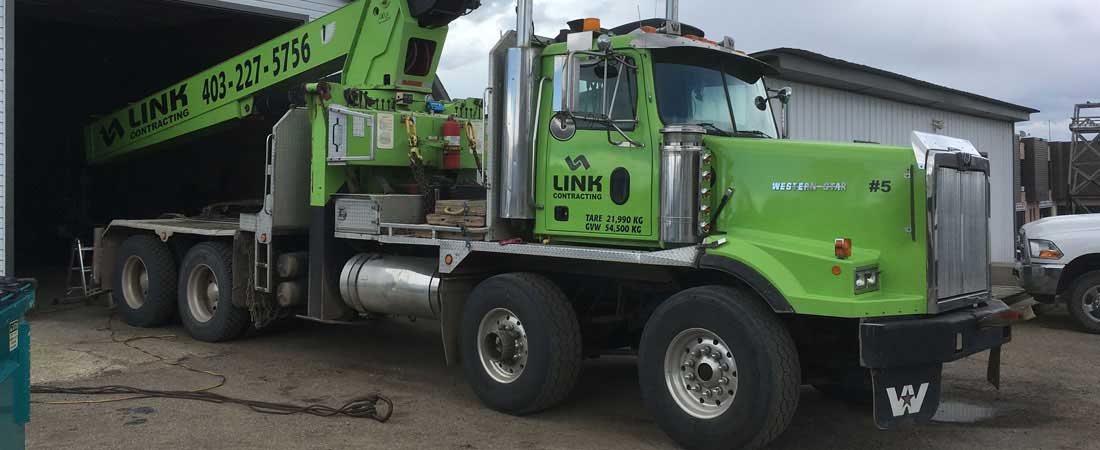 Link Contracting trailer truck for oil field hauling and picker services